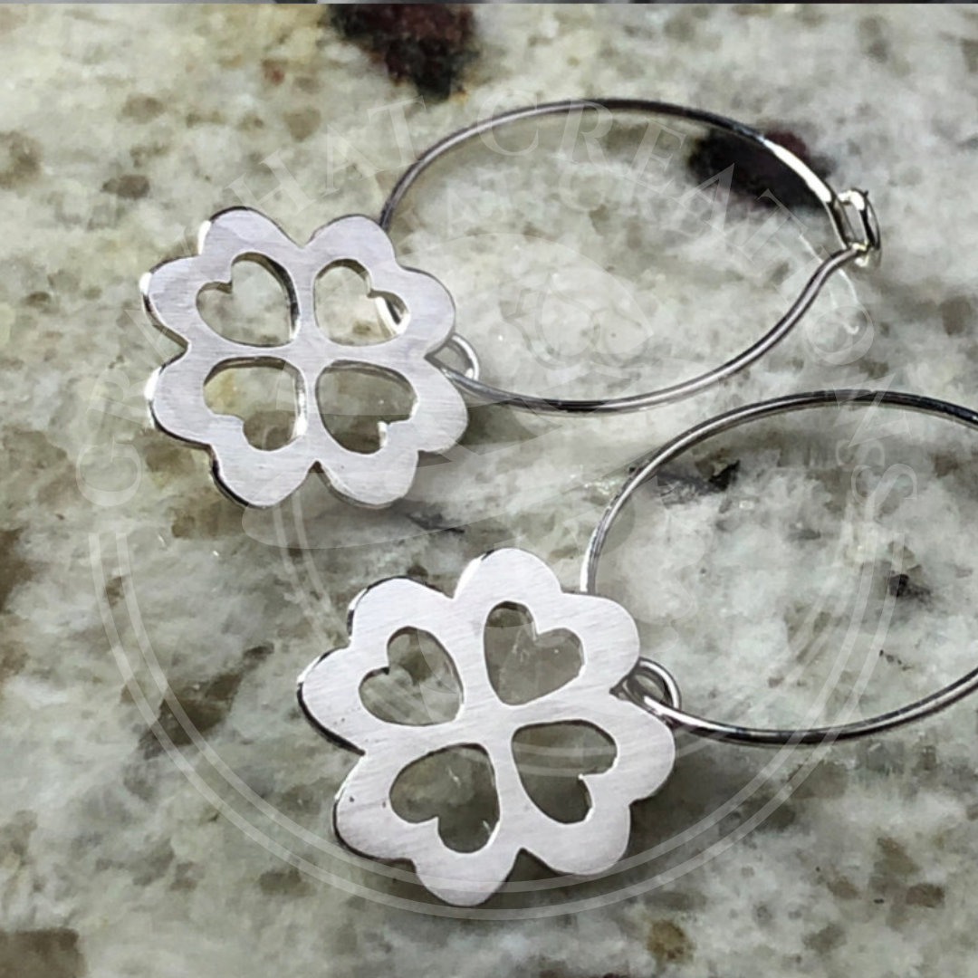 Sterling four-leaf clover earrings with heart cut-outs, each set on sterling  hoops